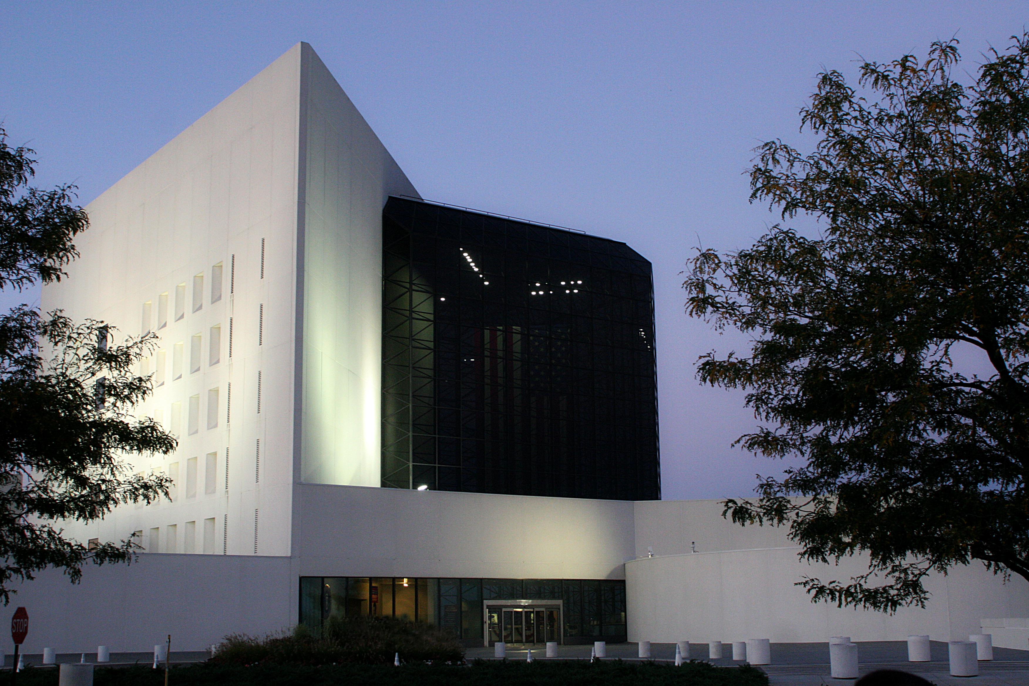 The front exterior of the JFK Library at twilight